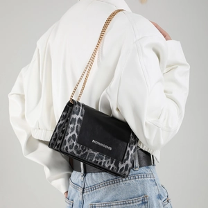 Fashionable leopard print crossbody chain bag with a black leather flap for daily commute