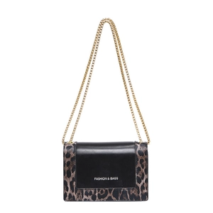 Fashionable leopard print crossbody bag with gold chain strap and black panel design