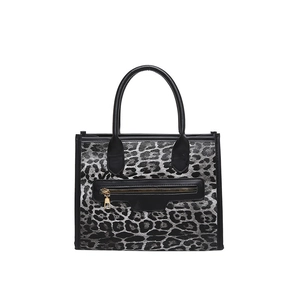 Fashionable leopard print tote bag with black and silver texture and gold zipper detail
