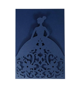 Detail of laser-cut evening gown silhouette on dark blue card with floral patterns
