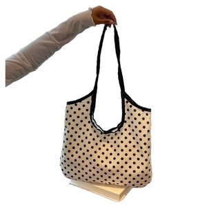 Minimalist white canvas tote bag with black polka dots and durable long straps