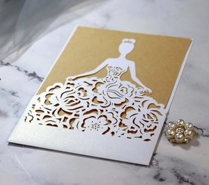 Detailed laser-cut hollow rose pattern on white pearlescent paper invitation card