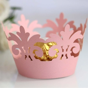 Pink laser-cut crown cupcake wrappers for dessert table decorations and party events