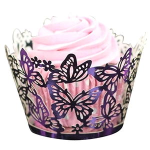 Deep purple laser-cut cupcake wrappers with elegant butterfly and floral vine patterns