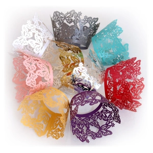 Laser cut butterfly and floral cupcake wrappers in various colors for wedding cake decoration