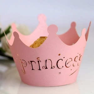 Pink princess crown cupcake wrapper with golden stars and princess lettering for parties