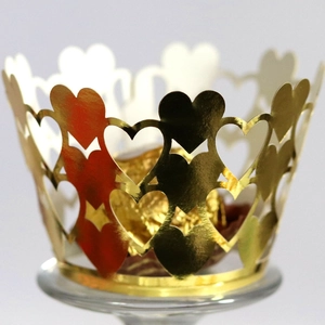 Laser-cut gold heart cupcake wrapper with elegant hollow design for dessert decor