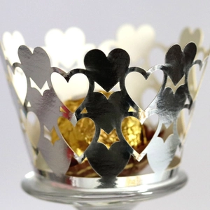 Elegant laser-cut silver heart cupcake wrappers with metallic finish for dessert decoration