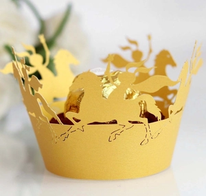 Golden laser-cut carousel cupcake liners and chocolate holders for party cake decoration