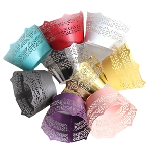 Laser cut cupcake wrappers in eight colors with intricate geometric lace and crown design