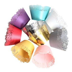 Laser cut star cupcake liners in pearlescent colors for party cake decoration