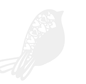 Detailed close-up showing heart-shaped laser cutouts on a white bird place card