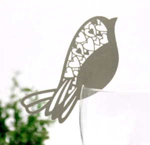 Laser-cut bird place card with heart patterns for wedding wine glass decoration
