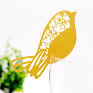Golden bird-shaped laser cut place cards with heart hollow design for glass decoration