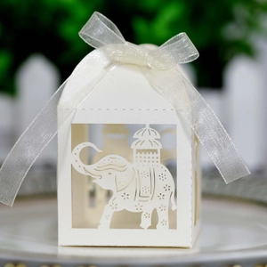 Laser-cut elephant candy box in pearlescent white with white silk ribbon bow tie