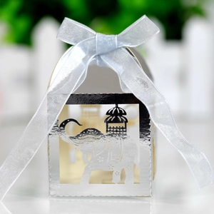 Silver mirror finish elephant laser-cut candy box with light blue ribbon bow
