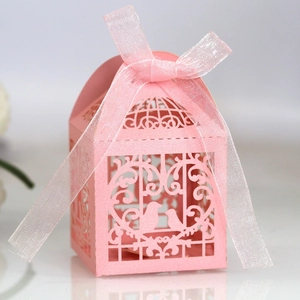 Pink laser cut wedding candy box with elegant love bird cage design and silk ribbon