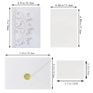 White snowflake laser cut invitation set with cards and envelopes for Christmas party