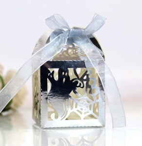 Laser-cut silver Halloween ghost gift box with spider web design and blue ribbon bow