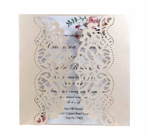 Detailed laser cut champagne pearl paper wedding invitation with floral printed insert