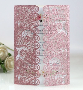 Detailed laser-cut floral pattern on pink glitter wedding invitation card and inner sheet
