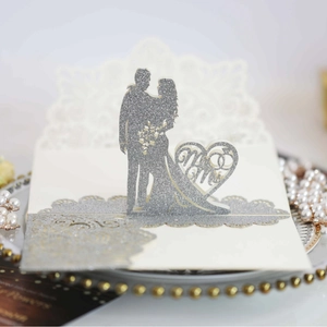 Silver glitter laser-cut wedding invitation with Mr & Mrs heart silhouette design