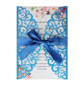Blue glitter laser-cut wedding invitation with satin ribbon bow and floral inner card