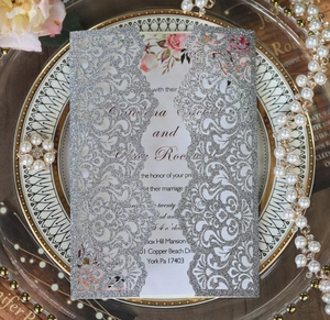 Laser-cut silver glitter wedding invitation with floral inner card and elegant details