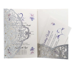 Laser-cut silver glitter wedding invitation with floral insert and wishing well card