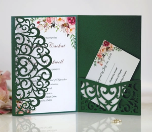 Detail of dark green laser cut wedding invitation set with floral card and RSVP card