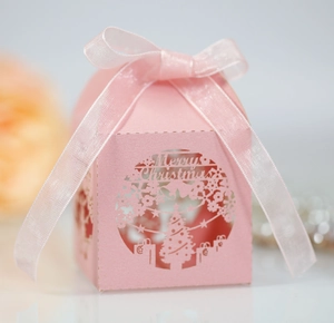 Pink Christmas gift box with laser-cut Merry Christmas design and sheer ribbon bow