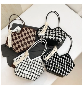 Detailed top view of four checkered hobo bags with unique heart-shaped openings