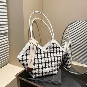 Classic black and white checkered tweed tote bag with shoulder strap and chic V-neck design