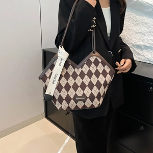 Vintage checkered shoulder bag in brown and beige with a V-shaped top and leather straps