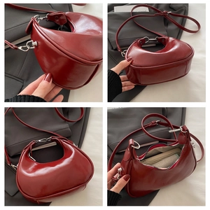 Detailed interior and exterior views of a dark red crescent handbag with silver hardware