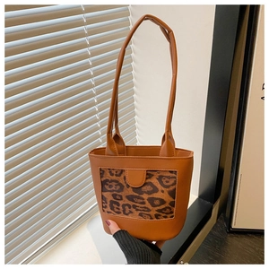 Detail of the vintage leopard print bucket bag with brown PU leather and slim shoulder strap