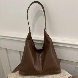 Retro brown faux leather tote bag with vertical stitching and long shoulder strap for women