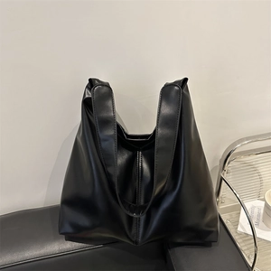 Minimalist large black tote bag in matte synthetic leather for office and daily commuting