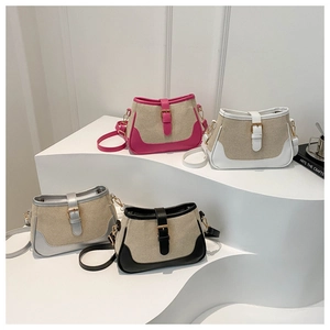 Close-up of four mini crossbody bags in canvas and leather with gold buckle detail