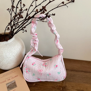 Pink floral drawstring underarm bag with quilted texture and ruched handle for women
