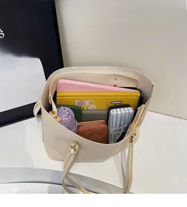 Spacious interior of a minimalist off-white tote bag showing large storage capacity