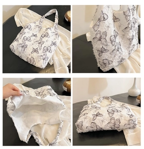 Detailed views of a white textured tote bag with black butterfly patterns and spacious interior