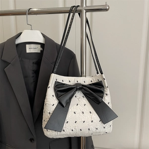 Polka dot bubble gauze tote bag with large black bow and sleek shoulder straps