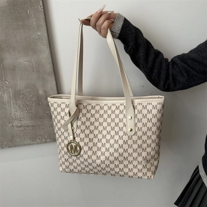 Minimalist beige tote bag with M-letter pattern and metallic logo for daily commuting
