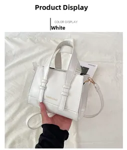 Detailed macro of white oil wax leather handbag with FASHION & BAGS lettering and strap