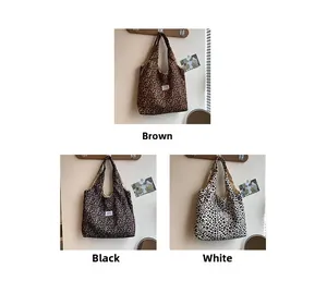 Detailed close-up showing brown black and white leopard print tote bags in three colors