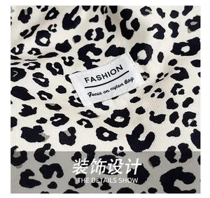 Detail shot of the durable leopard print nylon fabric and the fashion logo patch