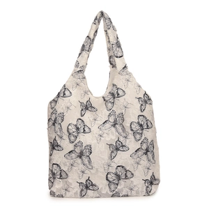 Off-white lace tote bag with black butterfly embroidery and minimalist shoulder design
