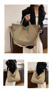 Dettaglio della borsa tote in tela kaki con ampi spallacci per uso quotidiano