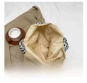 Detailed view of the leopard print tote bag showing its spacious inner storage space
